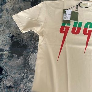 Mens authentic Gucci tee all original tags. Gucci blade design